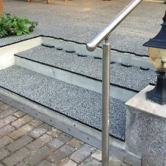 Grey external staircase leads into the garden. WARCO stair covering laid in grey.  Driveway to backyard