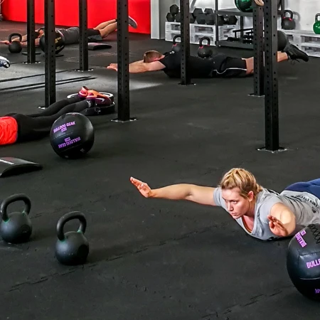 People train on WARCO fitness flooring in the fitness studio