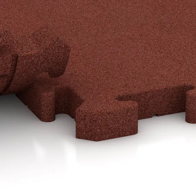 Großaufnahme vom Verbindungssystem von WARCO-Boden 4192 - Športová gumová podlaha HD im Farbdesign Cihlovo červená. Abmessungen 500 x 500 x 40 mm.