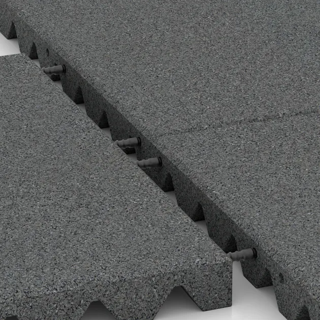 Großaufnahme vom Verbindungssystem von WARCO-Boden 0657 - Ochranná stenová doska im Farbdesign Šedý bridlica. Abmessungen 500 x 500 x 45 mm.