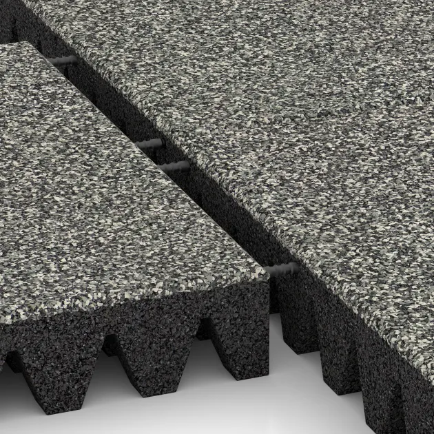 Großaufnahme vom Verbindungssystem von WARCO-Boden 5367 - Dopadová gumená podložka na ihrisko im Farbdesign Šedý granit. Abmessungen 500 x 500 x 80 mm.