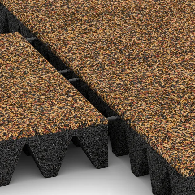 Großaufnahme vom Verbindungssystem von WARCO-Boden 3700 - Dopadová gumená podložka na ihrisko im Farbdesign Terra Cotta. Abmessungen 500 x 500 x 100 mm.